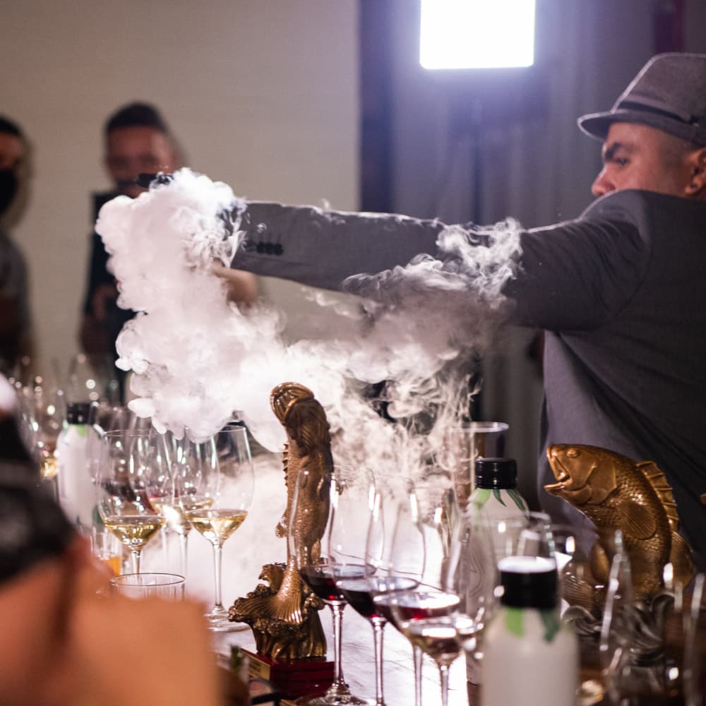 Marco Balza presents Fish House Punch to a blindfolded judges panel