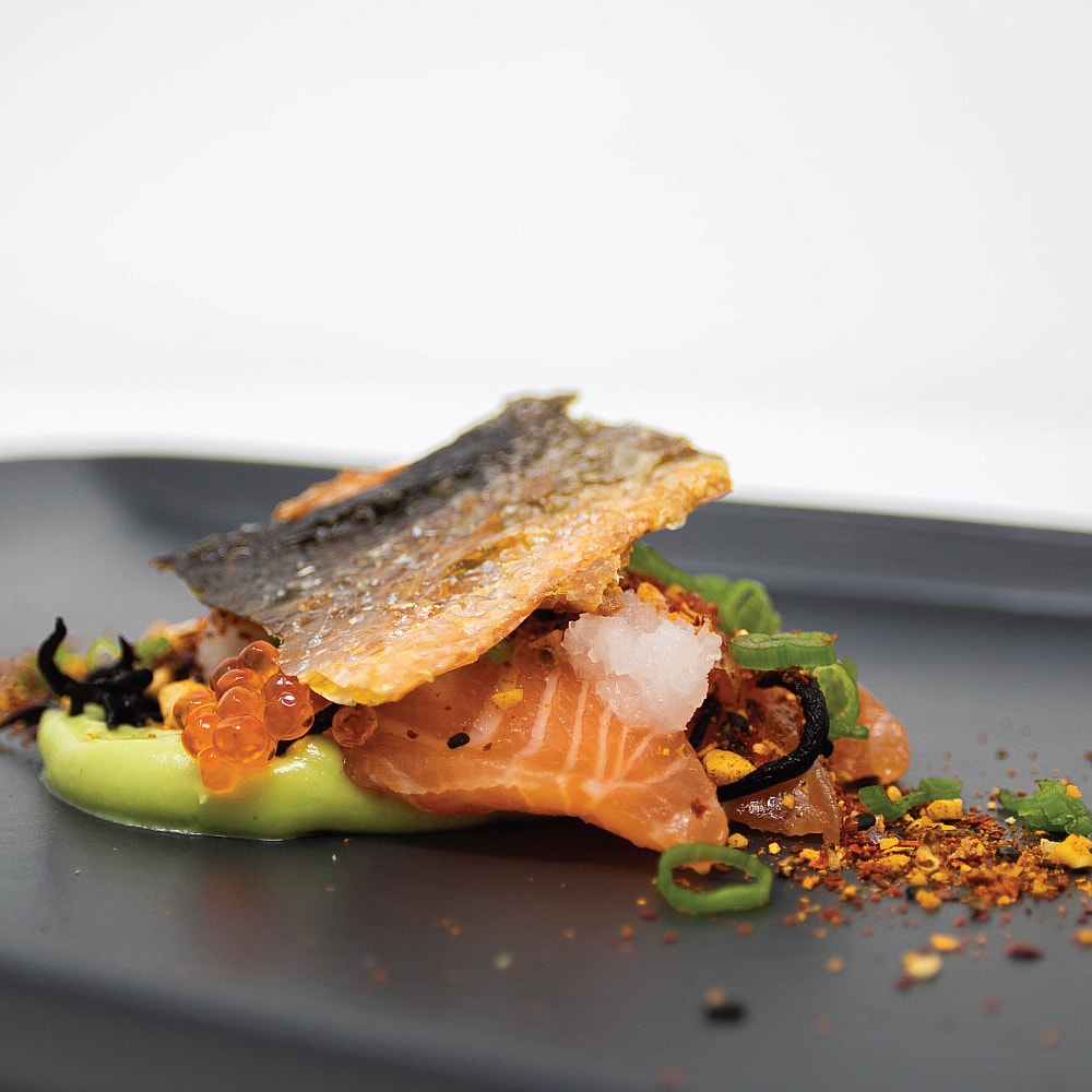 Chef Sutherland’s Miso and Sake Cured Salmon with Avocado Yuzu Puree, Daikon, Smoked Peanuts, Szechuan Togarashi and Crispy Salmon Skin