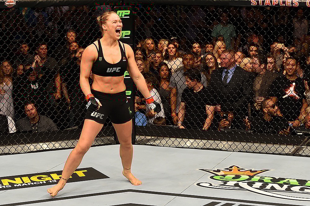 Celebrating after yet another UFC win. Do NOT step to this! Rousey
