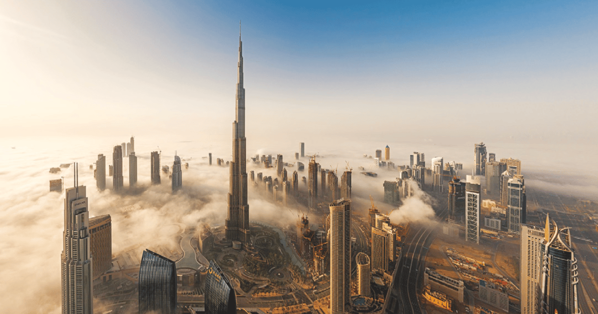 Aerial view of Dubai prominently featuring Burj Khalifa.