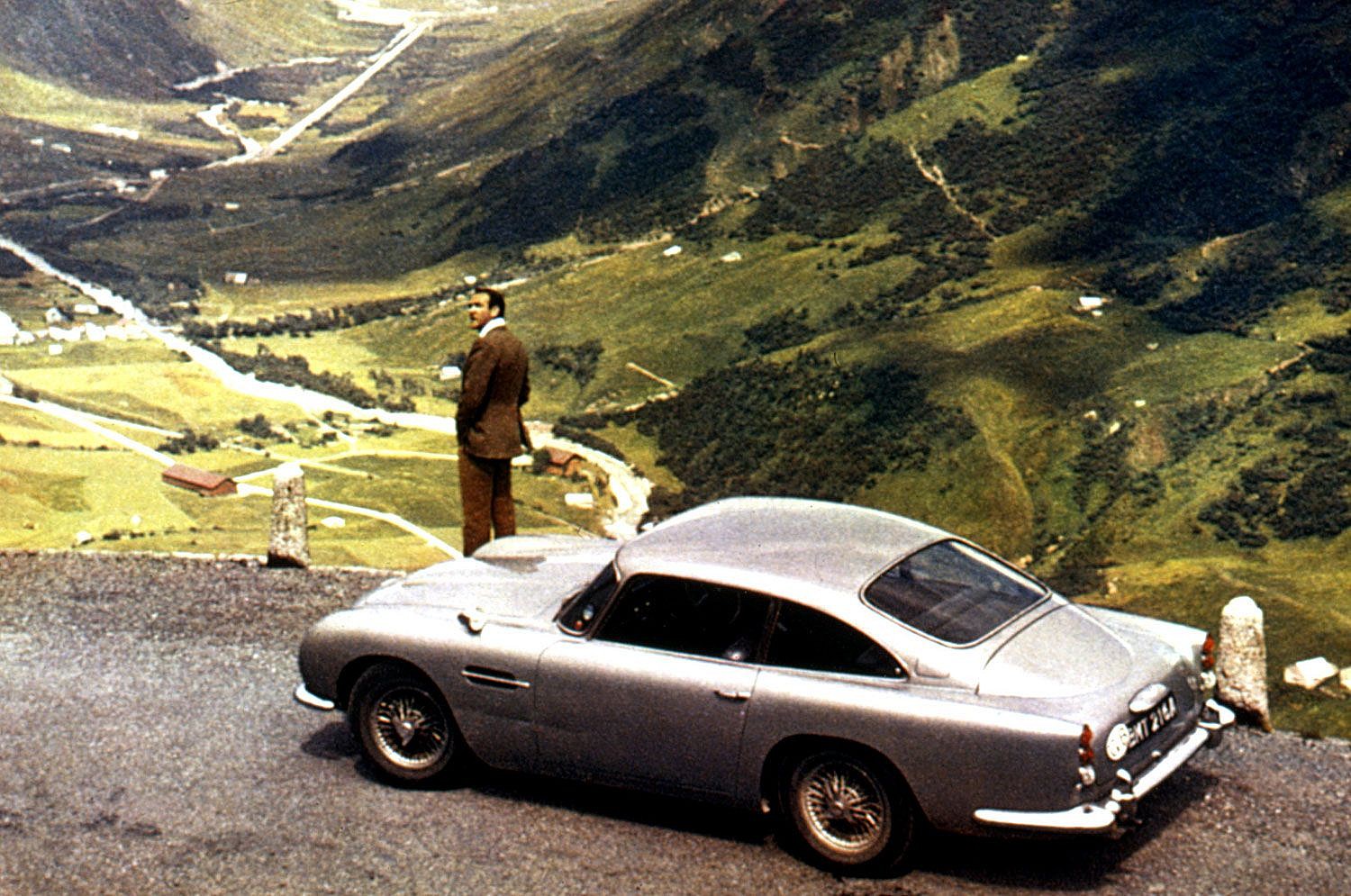 Goldfinger (1964) - Aston Martin DB5 Goldfinger (1964) - Aston Martin DB5 - The Driver: Connery originated the role with charm and Savile Row swagger and, to many, has never been surpassed.The Car: In silver-birch, the DB5 debuted with as much British style as Bond himself, plus some guns in the grill. Similarly unsurpassed.The Evolutionary Leap: Bond’s first Aston, and the franchise’s first icon.