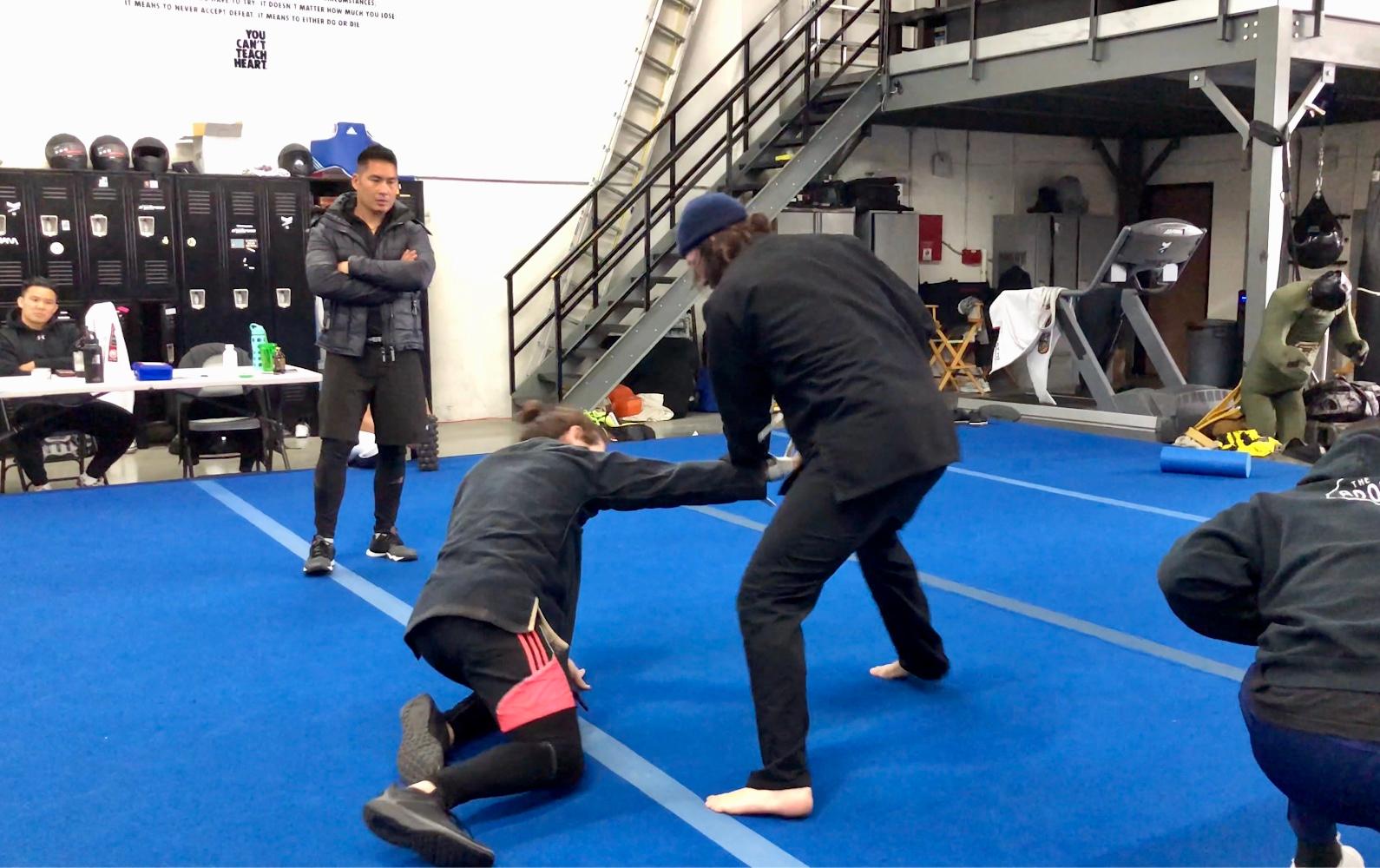 Jonathan Eusebio (left) training Keanu (in beanie)
