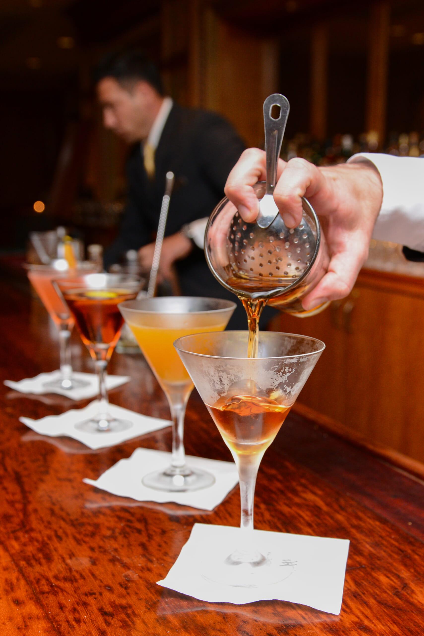 Signature cocktails being poured at Peacock Alley during a celebration of The Waldorf Astoria Bar Book_Photo Credit Waldorf Astoria New York.jpg