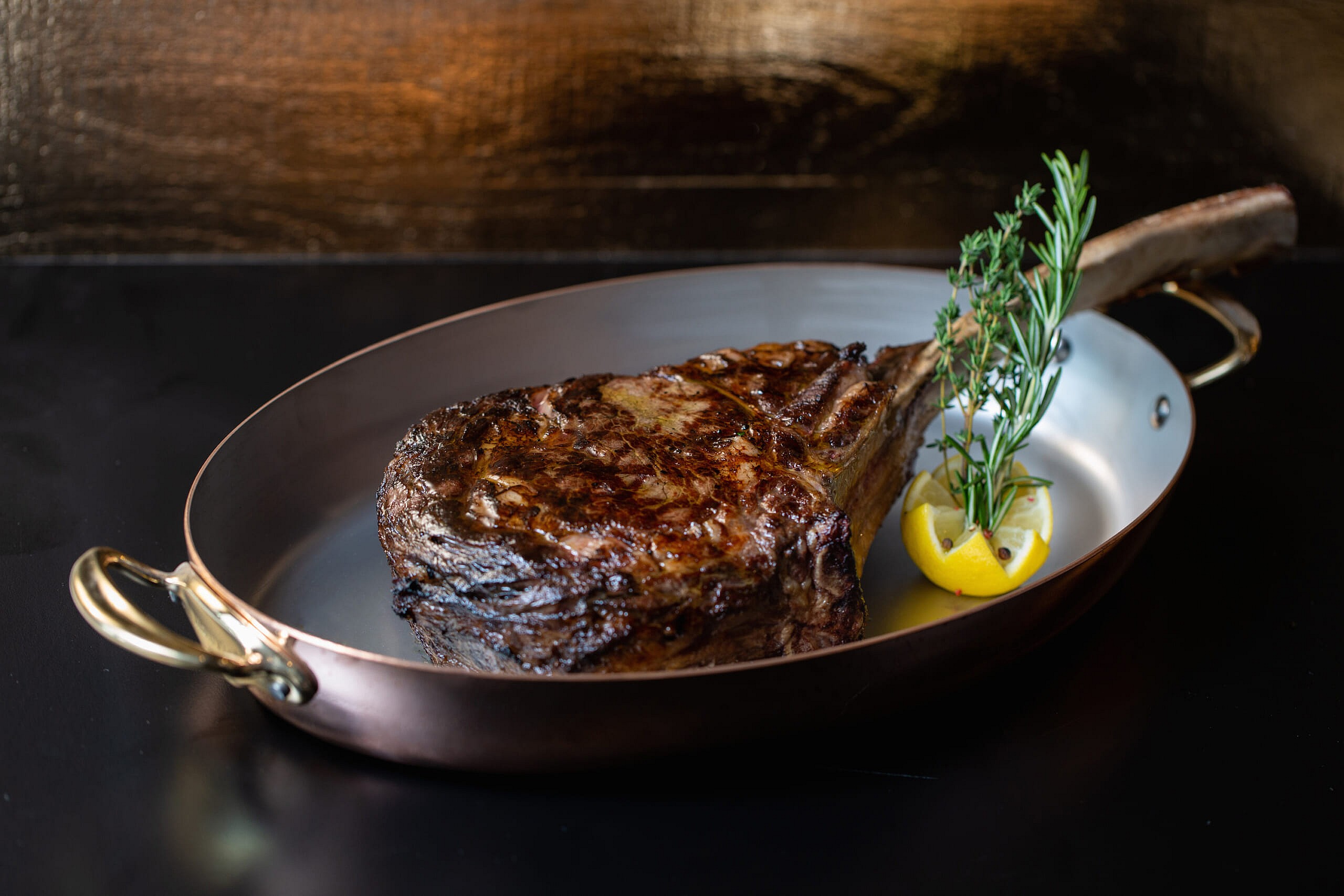 SLS Baha Mar Carna-Wood Grilled and Broiled Tomahawk Steak