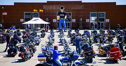 A motorcycle rider outside the Full Throttle Saloon during the 80th Annual Sturgis Motorcycle Rally in Sturgis