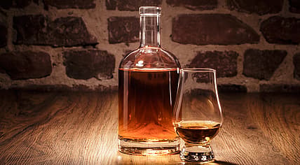 Liquor in a decanter and glass.