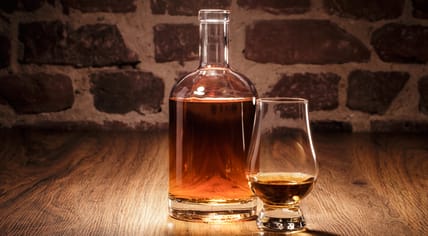 Liquor in a decanter and glass.