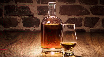Liquor in a decanter and glass.