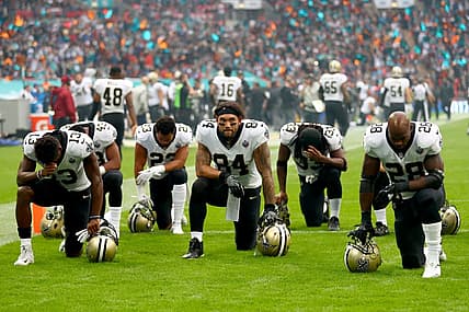 New Orleans Saints players and team kneel prior to the NFL match between New Orleans Saints and Miami Dolphins at Wembley Stadium on October 1