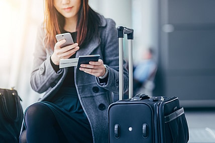 woman-passport-phone-travel-GettyImages-607326981