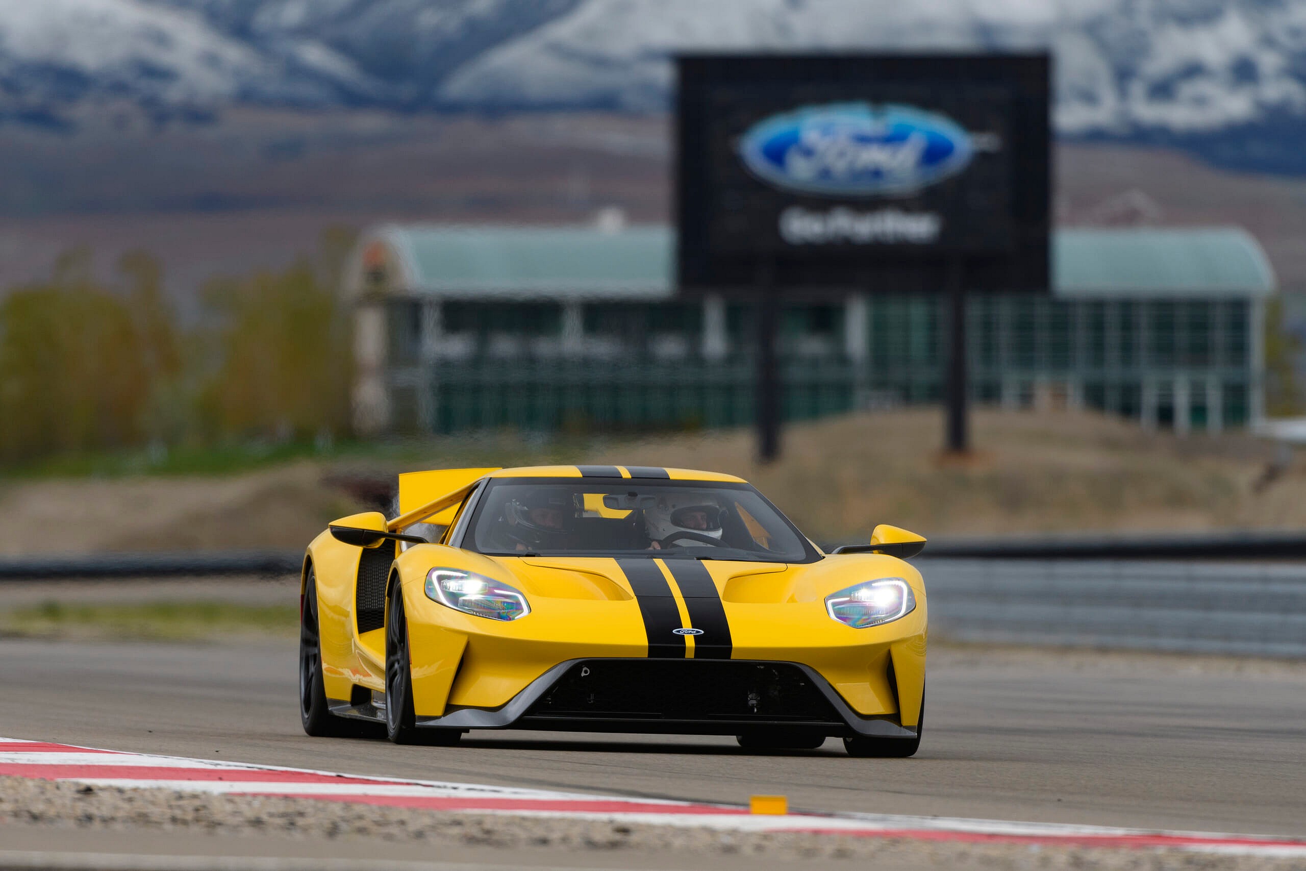 Yellow and black Ford GT on track