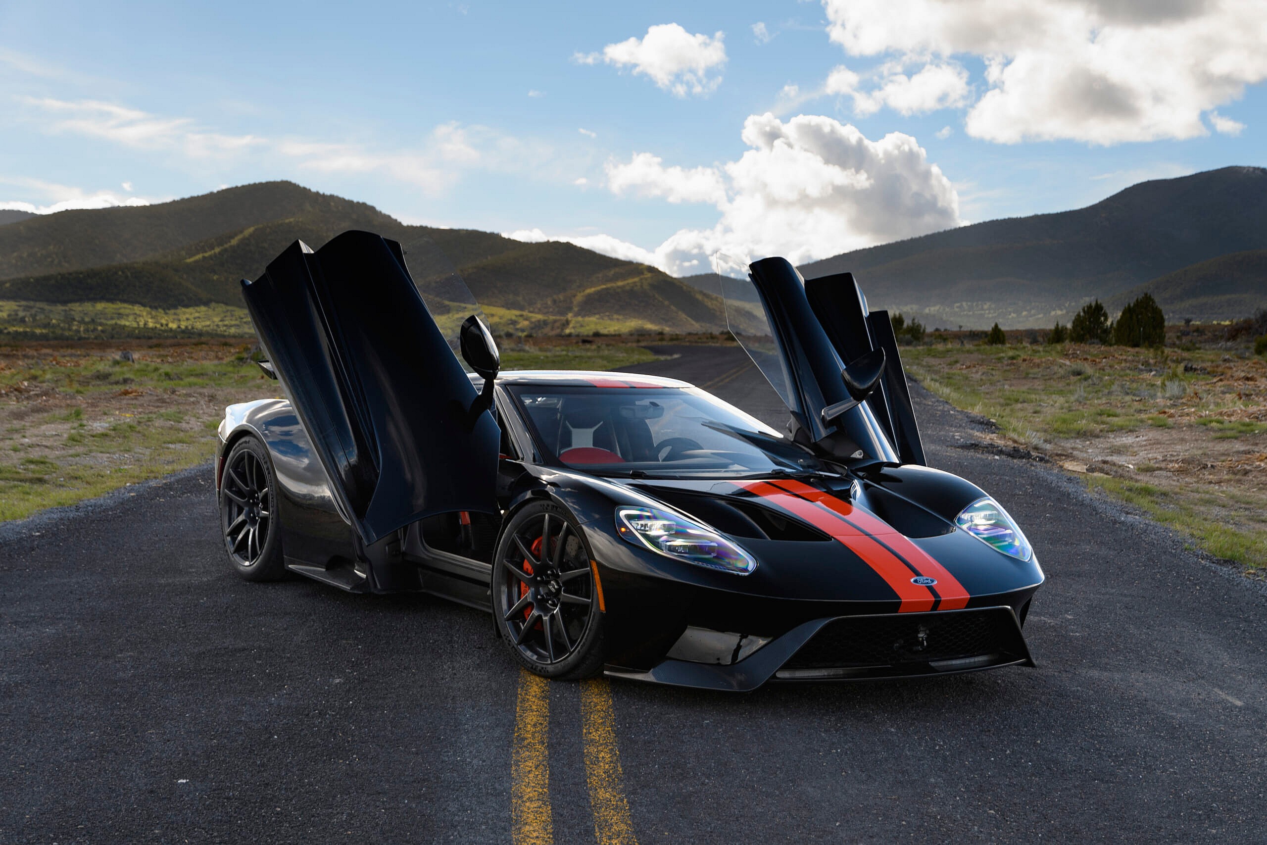 Black and orange Ford GT with doors open