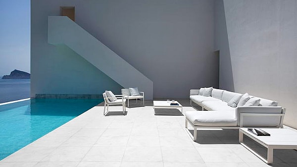 A placid pool on the lower level overlooks the sea