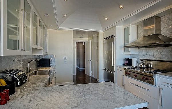 A modest kitchen with vaulted ceiling