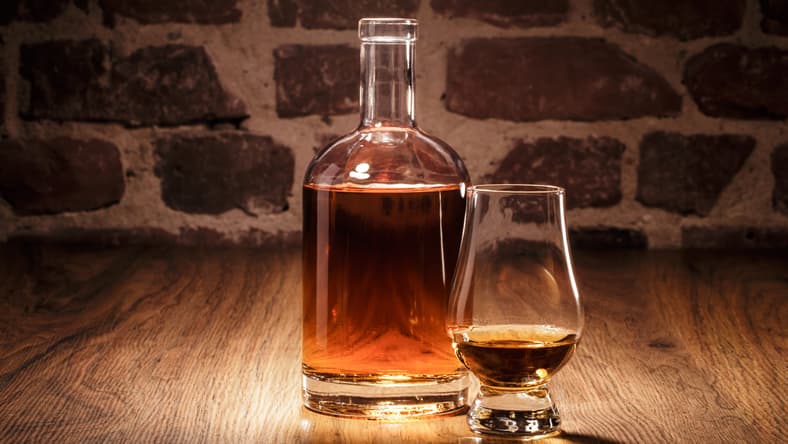Liquor in a decanter and glass.
