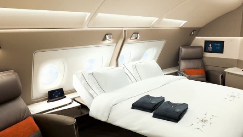 Queen bed. ON A PLANE