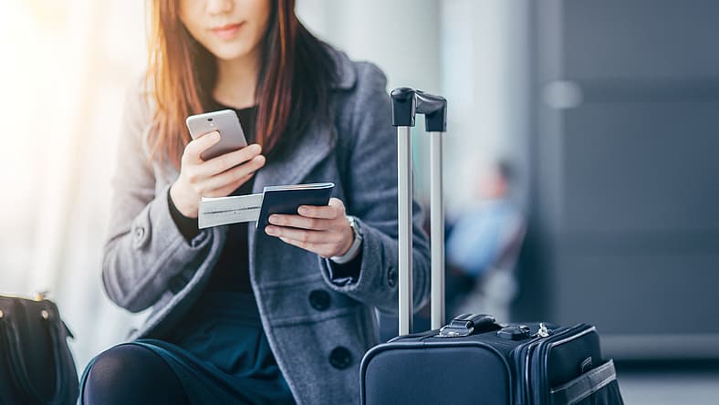 woman-passport-phone-travel-GettyImages-607326981