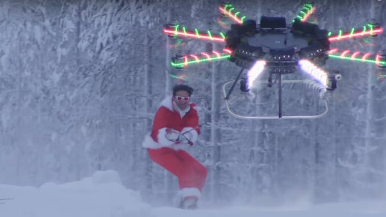The video starts with the drone towing Neistat on a snowboard