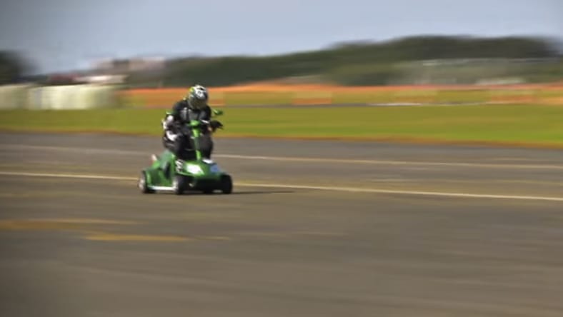 Mathew Hine rides the record-setting scooter to glory