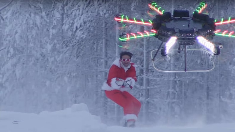 The video starts with the drone towing Neistat on a snowboard