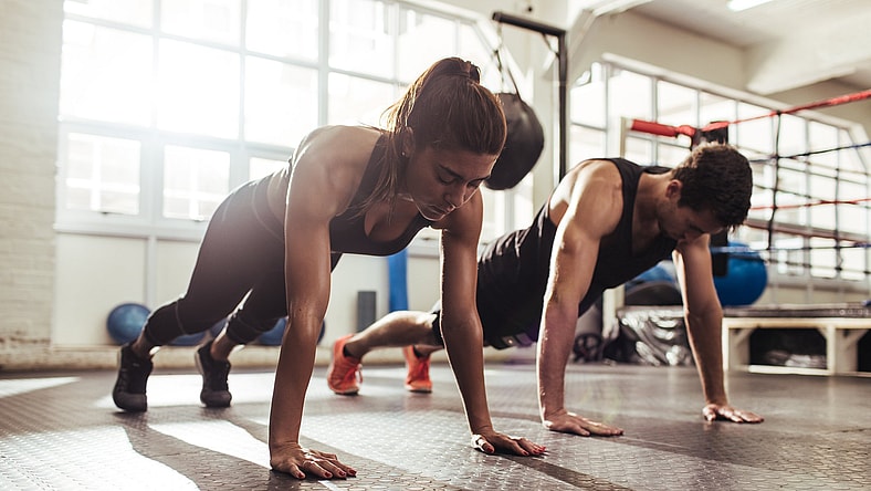 couple-doing-pushups-GettyImages-951498646