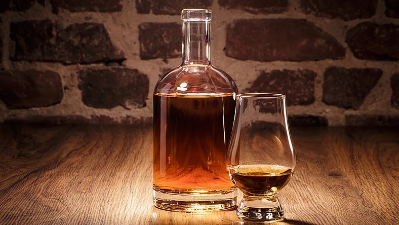 Liquor in a decanter and glass.