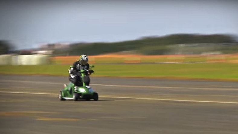 Mathew Hine rides the record-setting scooter to glory