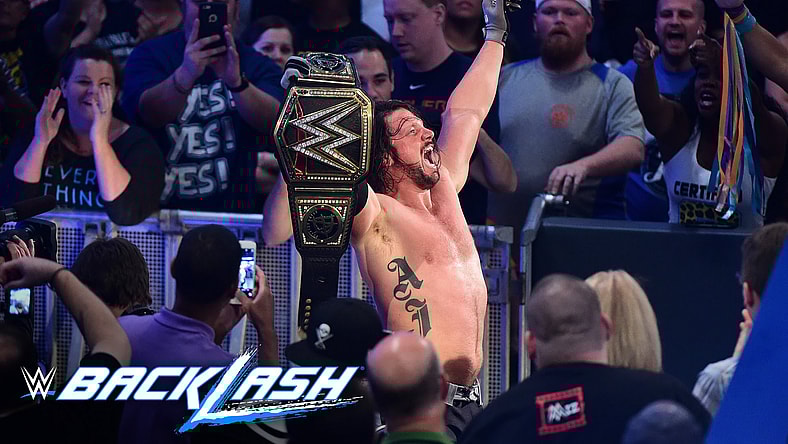 AJ-Styles-raises-his-hands-high-as-the-new-WWE-World-Champion-Backlash-2016.jpeg
