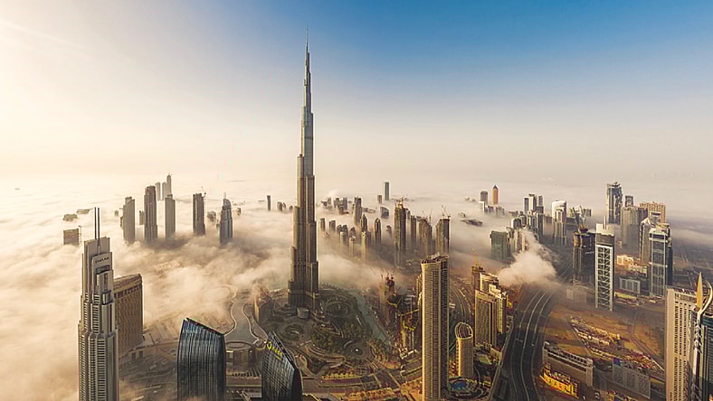 Aerial view of Dubai prominently featuring Burj Khalifa.