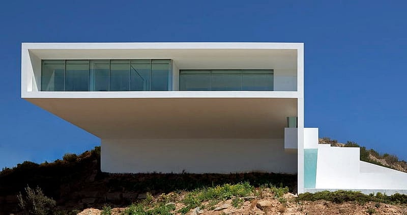 House on the Cliff is precarious perched over the Mediterranean