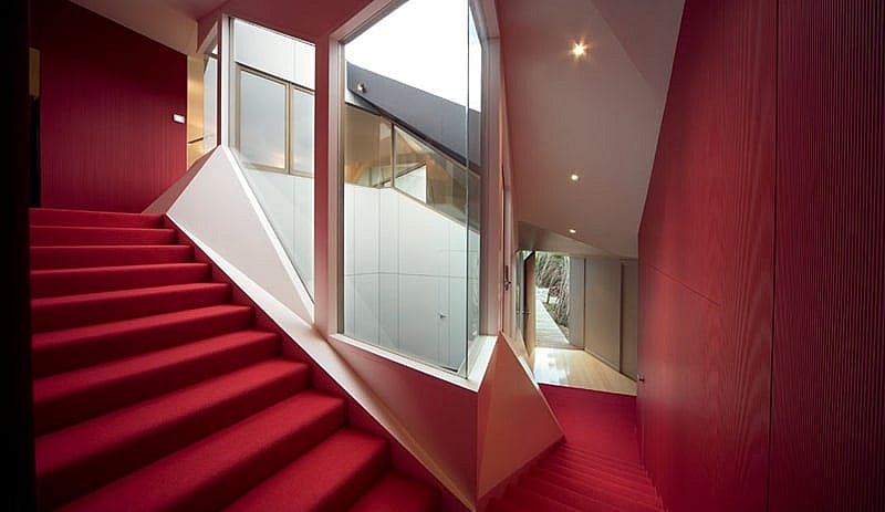 McBride Charles Ryan's Klein Bottle House - red staircase.jpg The windy staircase is the source of the house's paradoxical mathematical name (Photo: McBride Charles Ryan)
