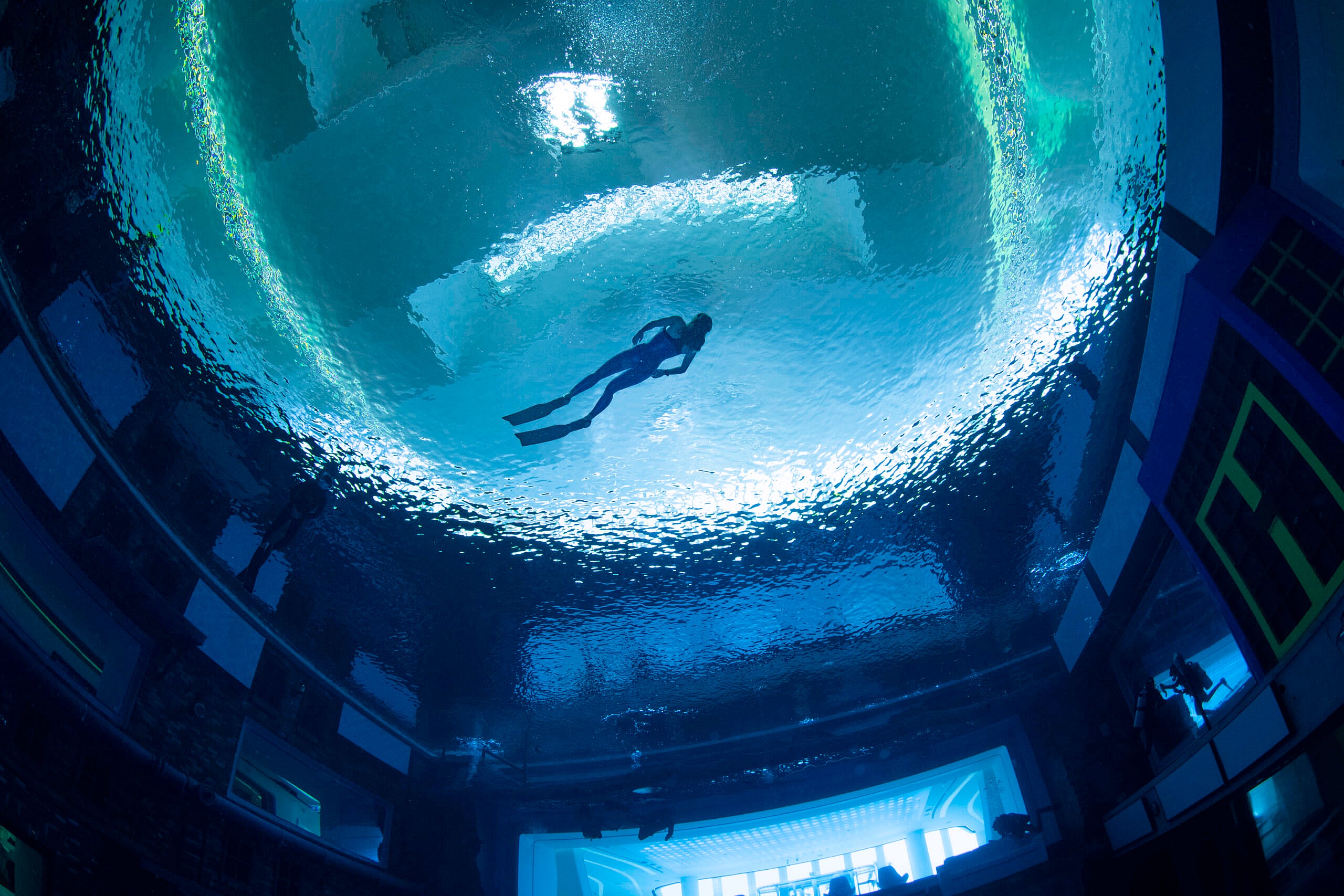 8 - Deep Dive Dubai - a freediver rises to the pool surface
