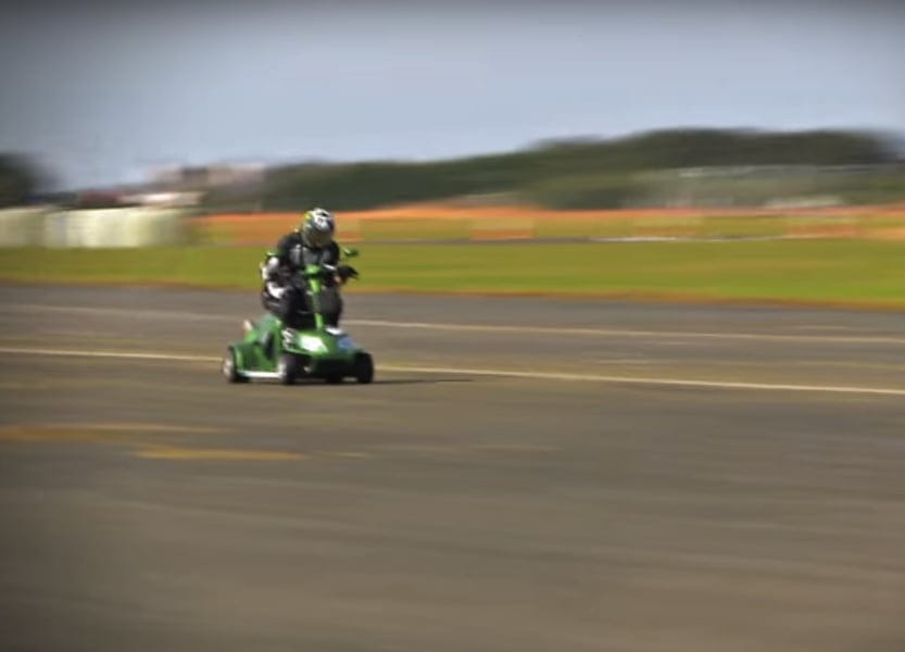 Mathew Hine rides the record-setting scooter to glory