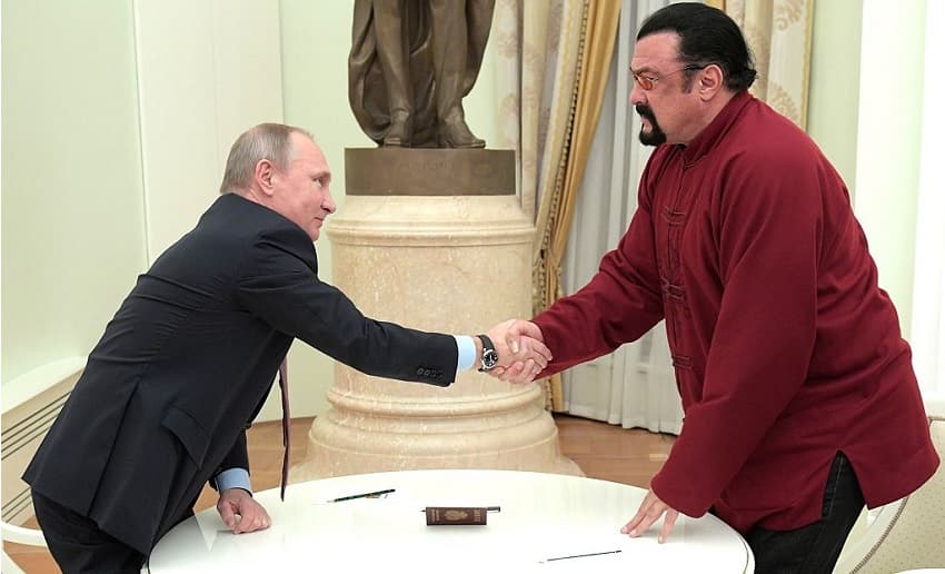 putin-seagal-passport.jpg Vladimir Putin Steven Seagal Getty