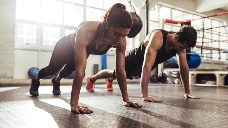 couple-doing-pushups-GettyImages-951498646
