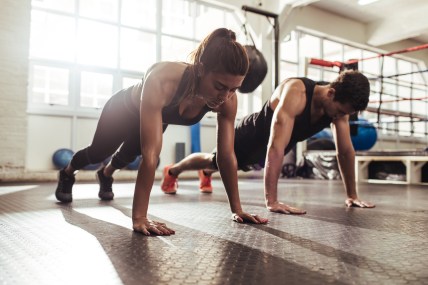 couple-doing-pushups-GettyImages-951498646