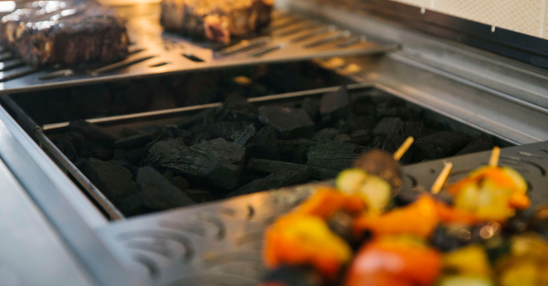 Coyote Outdoor Grill - charcoal pit.jpg Other accessories include a drop-in charcoal tray