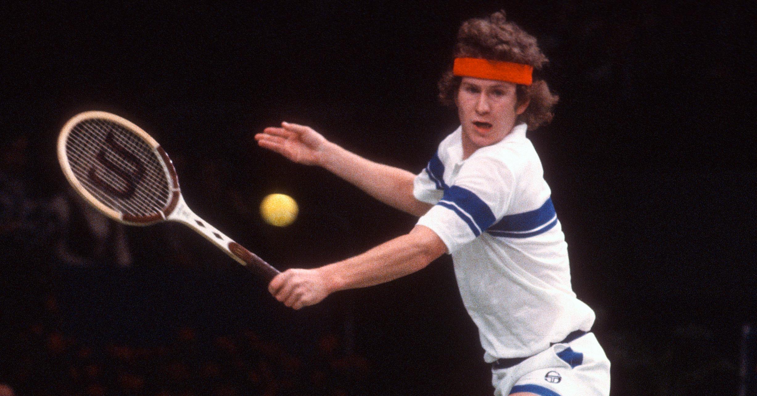 RANCHO MIRAGE, CA - CIRCA 1978: John McEnroe of the United States hits a return during a match in the 1978 Davis Cup finals December 10, 1978 at the Mission Hills Country Club in Rancho Mirage, California.