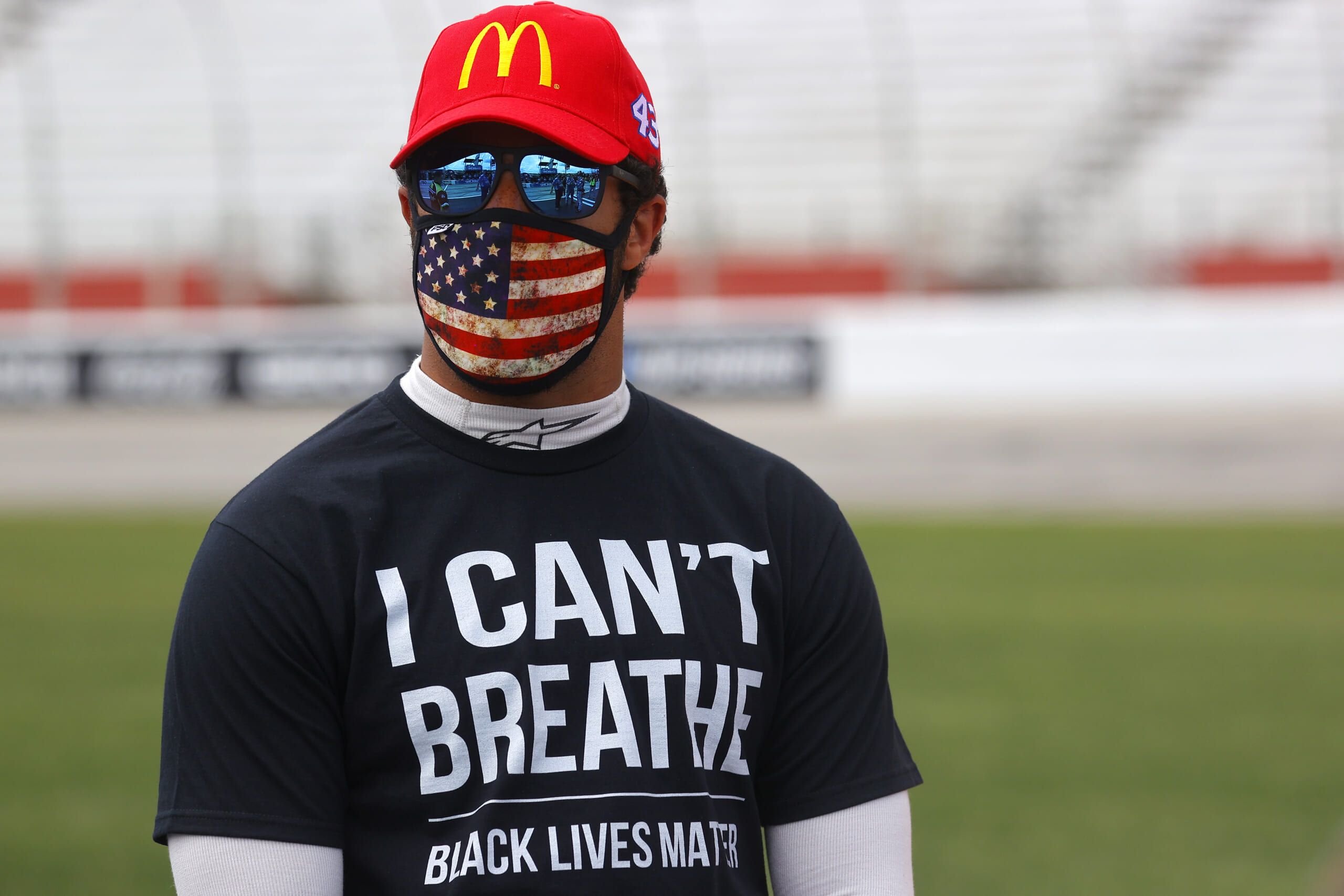 Bubba Wallace, driver of the #43 McDonald's Chevrolet, wears a 