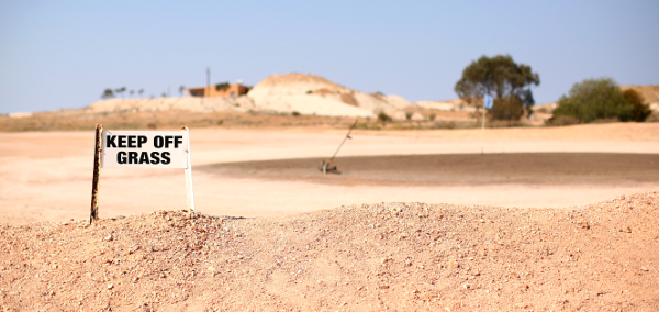 The oil-soaked putting area is anything but green