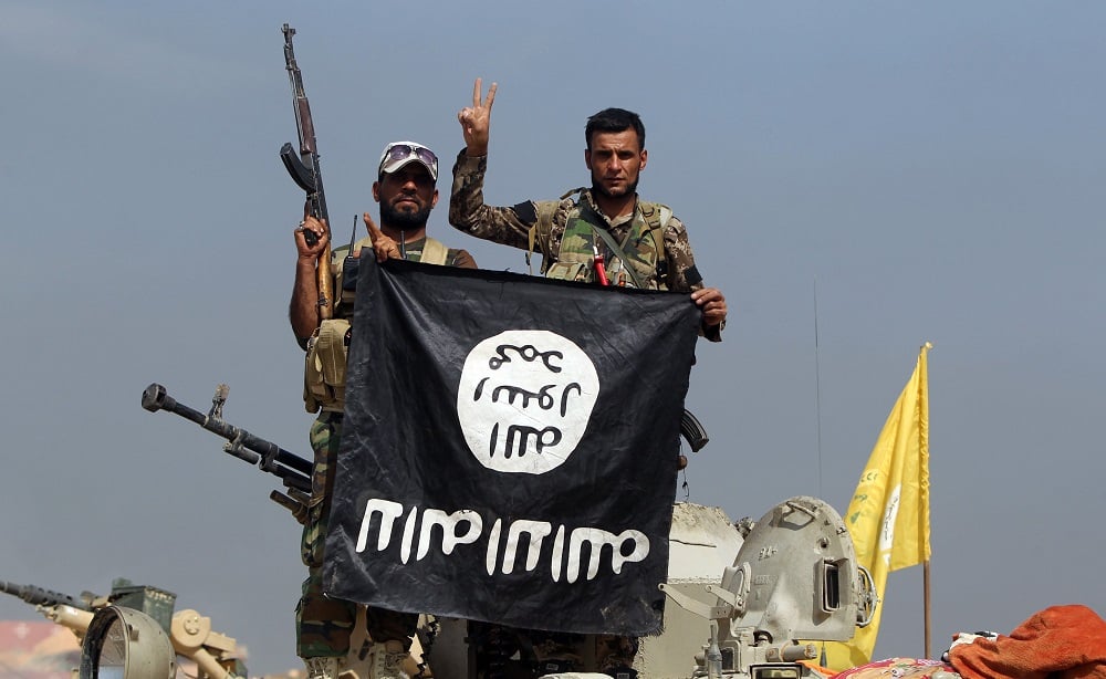 Iraqi fighters ISIS flag Getty