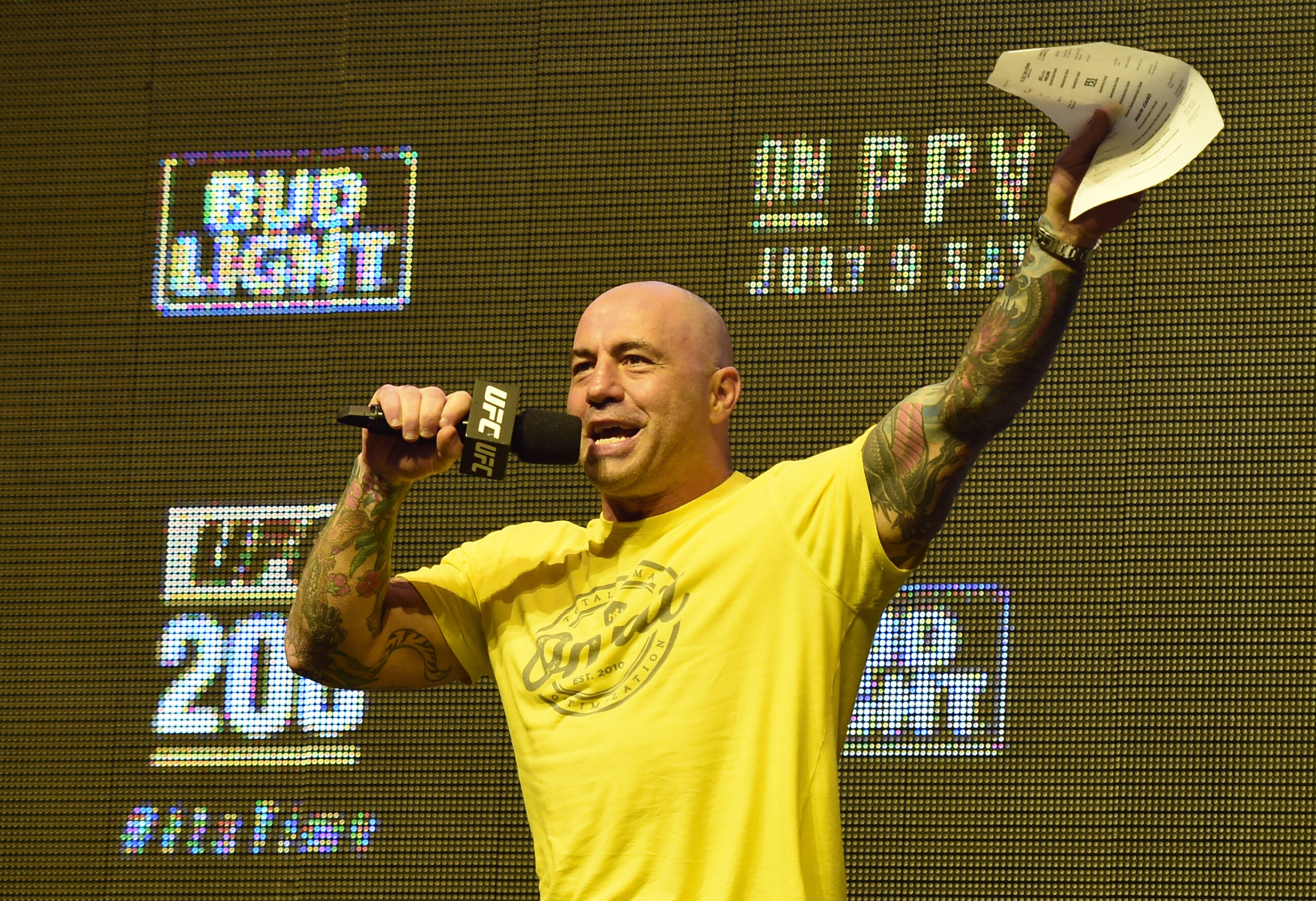 Joe Rogan Commentator Joe Rogan speaks during weigh-ins for a UFC event.