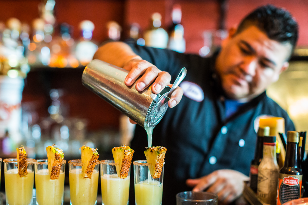 vallarta mixologist pouring drinks