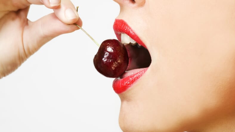 woman eating cherry