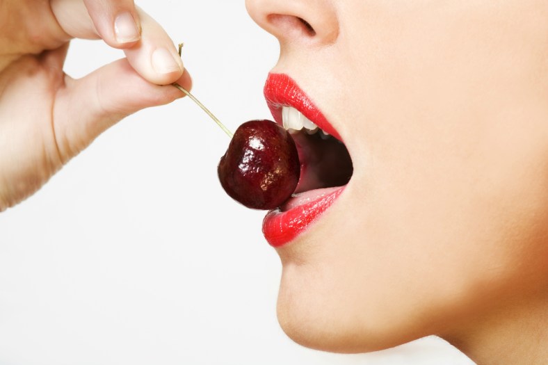 woman eating cherry