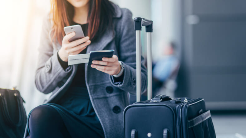 woman-passport-phone-travel-GettyImages-607326981