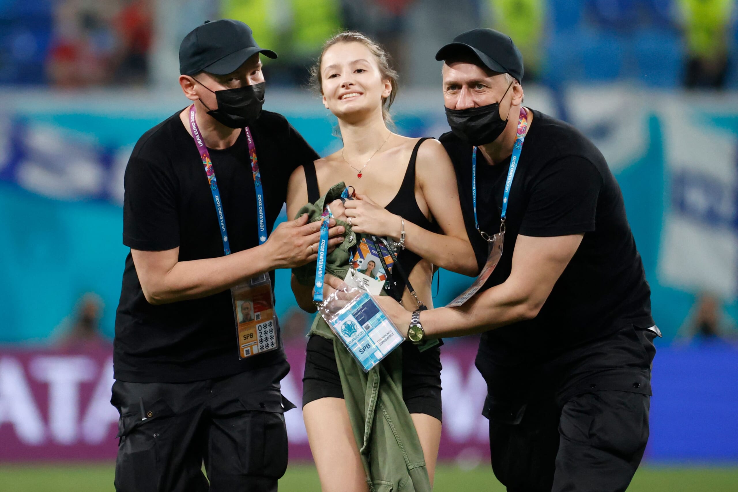 Stadium security stop a pitch invader during the UEFA EURO 2020 Group B football match between Finland and Belgium at Saint Petersburg Stadium in Saint Petersburg, Russia