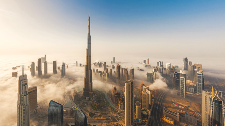 Aerial view of Dubai prominently featuring Burj Khalifa.